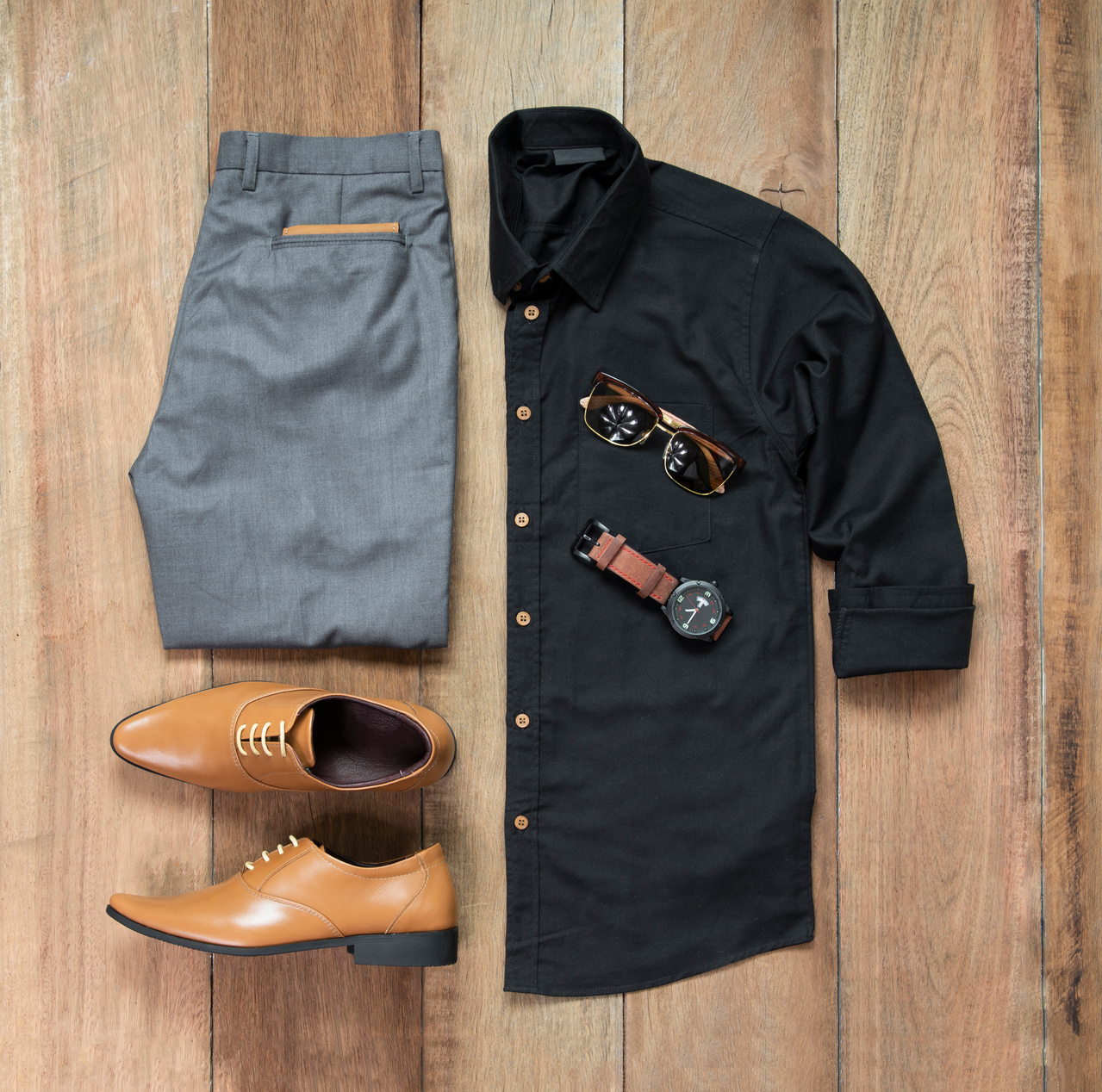 Men fashion clothing set on wooden background. top view