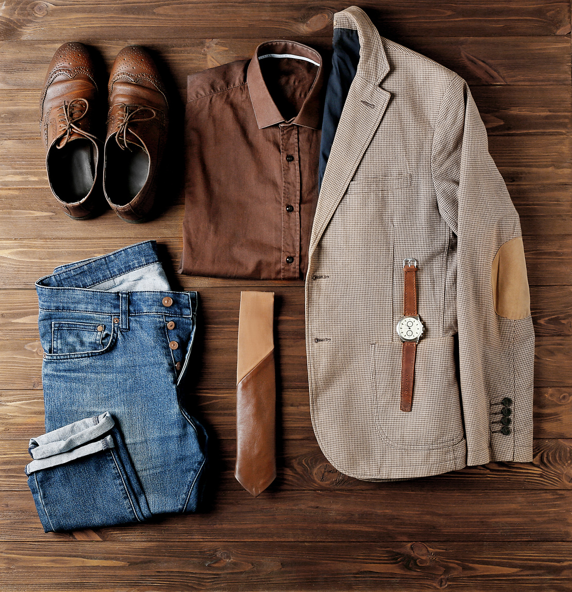 Men's Clothes and Accessories on Wooden Background